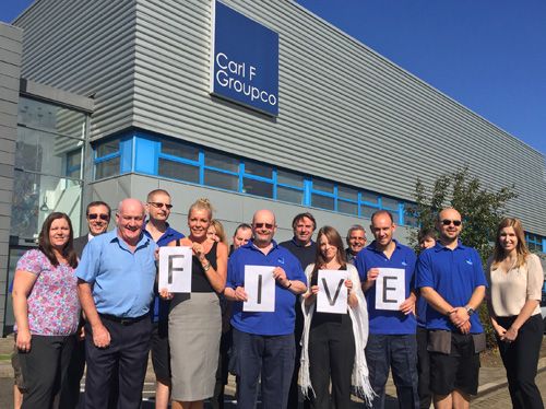 Members of Carl F Groupco’s Peterborough workforce mark the fifth anniversary since the merger of Groupco and Carl F