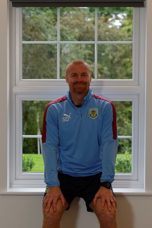 Sean Dyche with one of his new 'A' rated, fully sculptured windows from The Veka UK Group, fabricated and fitted by Glazerite and MG Windows respectively