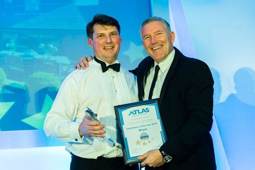 Paul Nellis of Orangery Solutions collecting the award from Gareth Thomas