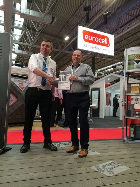 Lee Robinson, senior category manager, Eurocell (left) and Tony Pratt, sales director, Composite Wood Company, shake on it following a supply deal