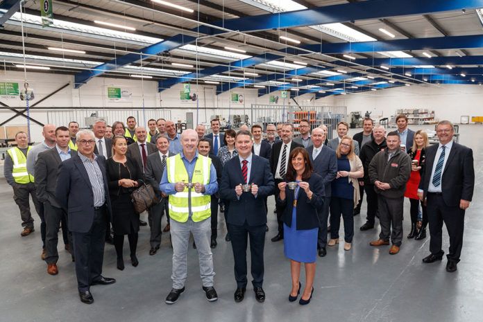 (Front, L-R) Marking the opening of the new CMS Trade factory in East Kilbride: Stuart Glen, CMS Trade Factory Manager; David Ritchie, CEO of CMS Window Systems; and Cllr Collette Stevenson, Depute Provost of South Lanarkshire Council.