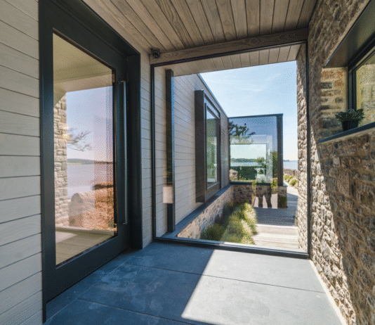Reynaers SlimLine 68 delivers premium coastal performance for estuary boathouse project